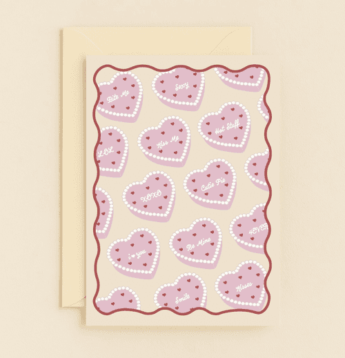 Celebrate Valentine's Day with a playful card featuring candy hearts and punny messages, perfect for sweetening your loved one's day.