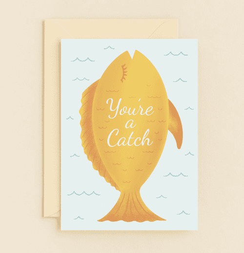 Catch their heart this Valentine's Day with a whimsical fish-themed card featuring playful wordplay and minimalist design.