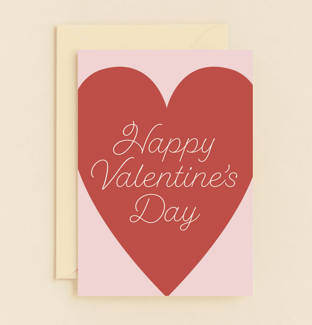 Celebrate Valentine's Day with a simple yet elegant card featuring a heartfelt red heart and cursive wishes on a soft pink backdrop.