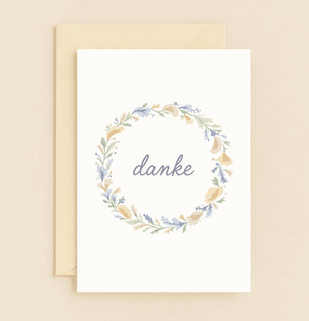 Express heartfelt thanks with the "Floral Whispers of Gratitude" card, featuring a German "danke" amidst a pastel floral wreath in a minimalistic design.