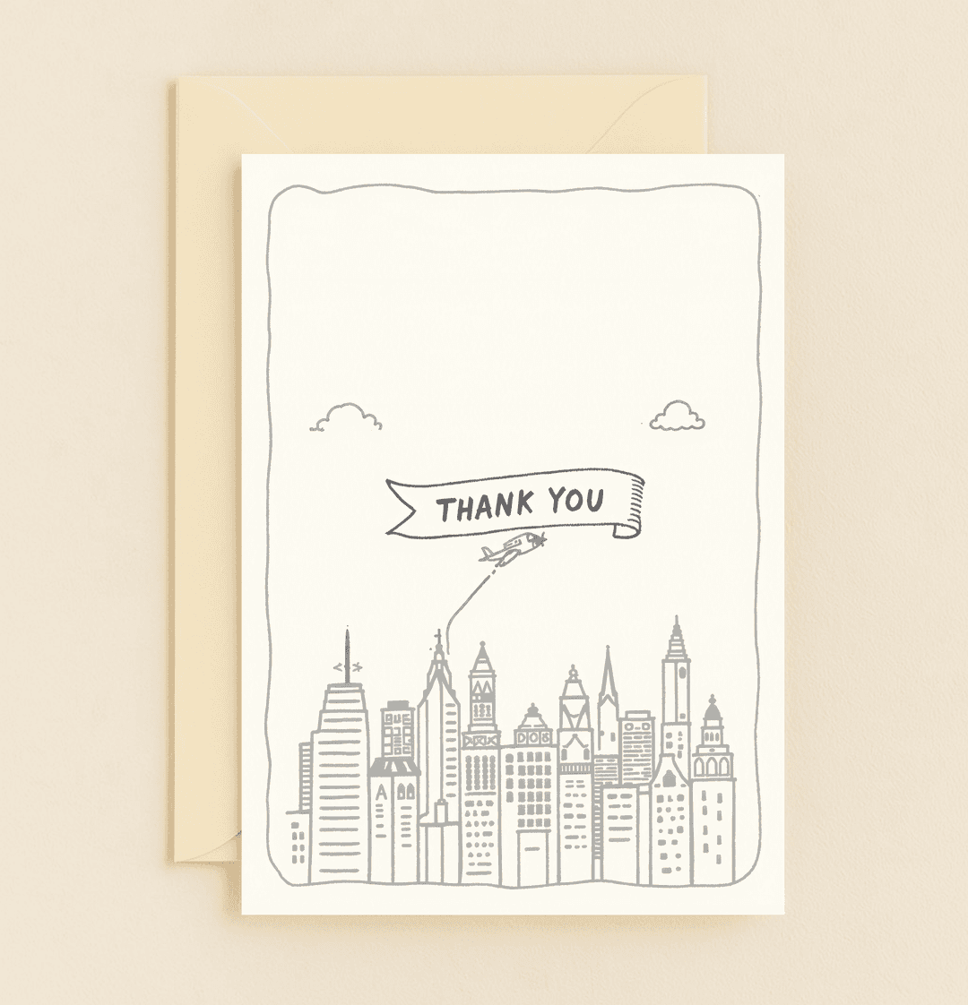 Express gratitude with a touch of humor as a biplane flies a cheerful "THANK YOU" banner over a minimalist grayscale city skyline.