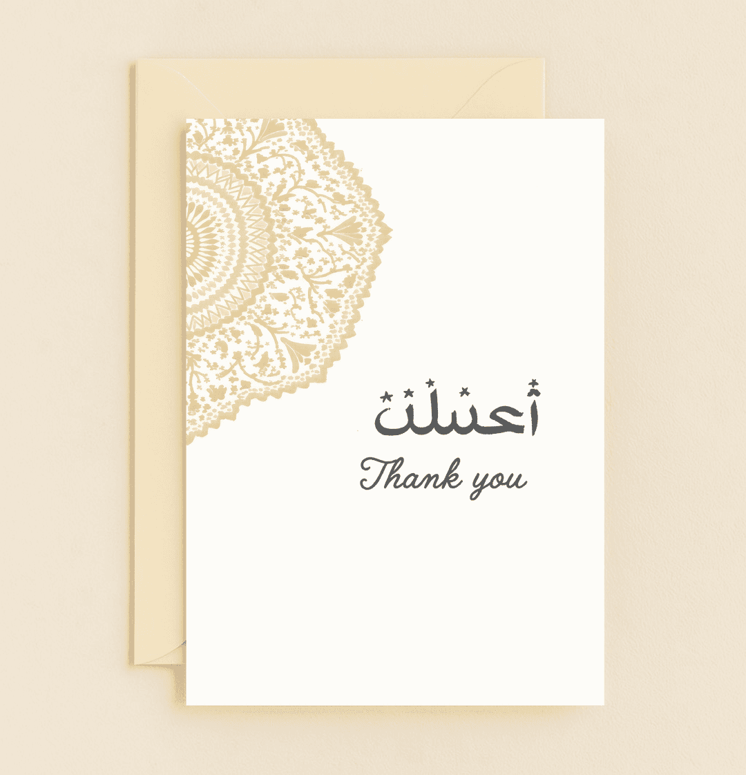 Express gratitude with sophistication through this elegant card, featuring a golden mandala and bilingual "Thank You" in exquisite Arabic and English calligraphy.