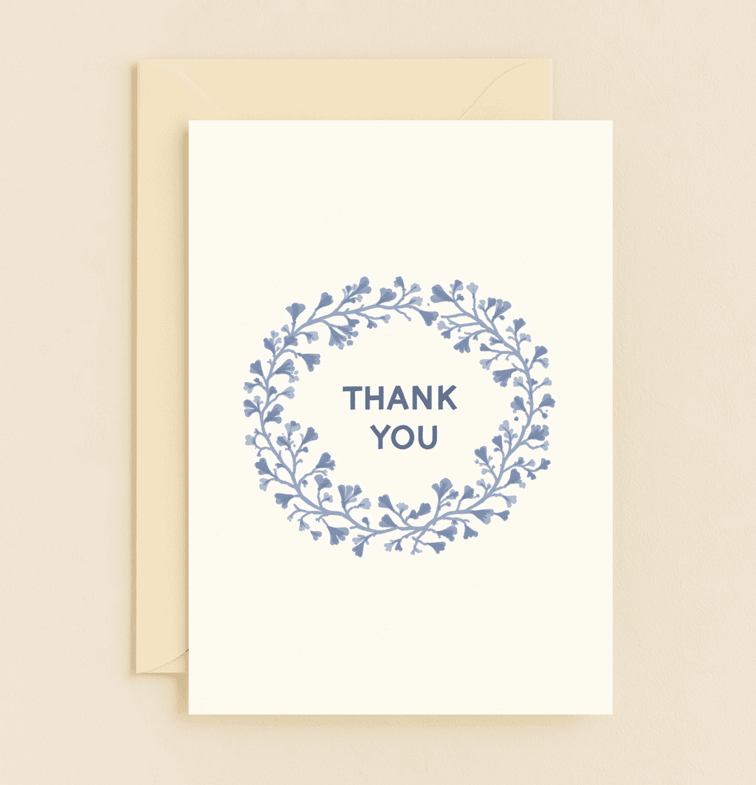 Express heartfelt gratitude with this elegant thank you card featuring a minimalist blue floral wreath on a soft background.