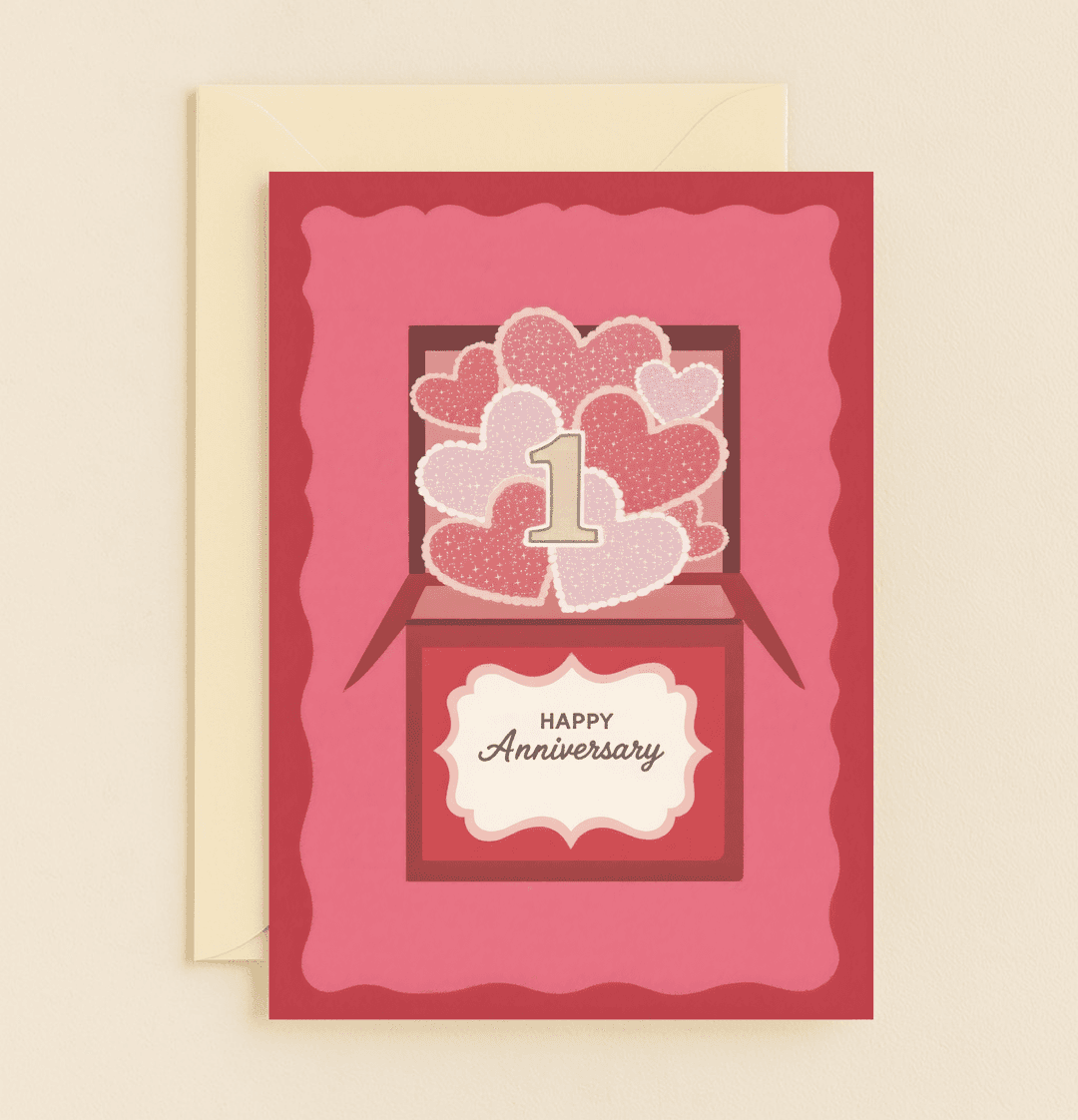 Celebrate your first anniversary with a heartfelt card featuring a romantic design of hearts and an elegant gift box, symbolizing a year of love and joy.