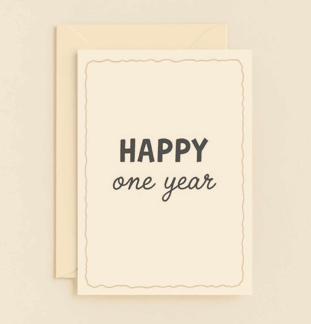 Celebrate your first year of love with this elegant cream-colored anniversary card, featuring charming wavy borders and sophisticated typography.