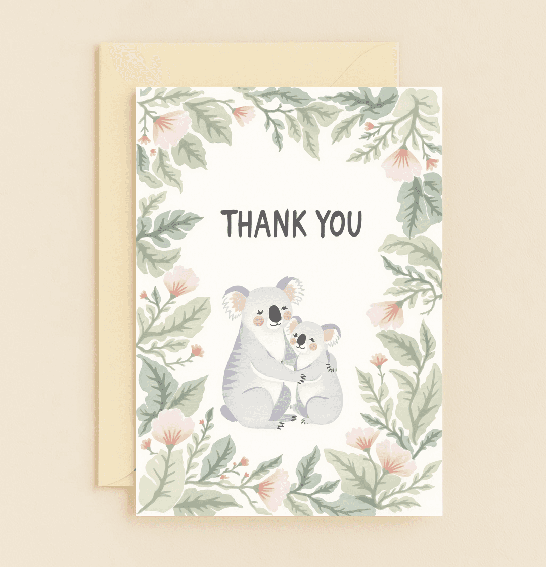 Express heartfelt thanks with "Koala Hugs of Gratitude," featuring adorable koalas embracing in a soothing watercolor design of flowers and leaves.