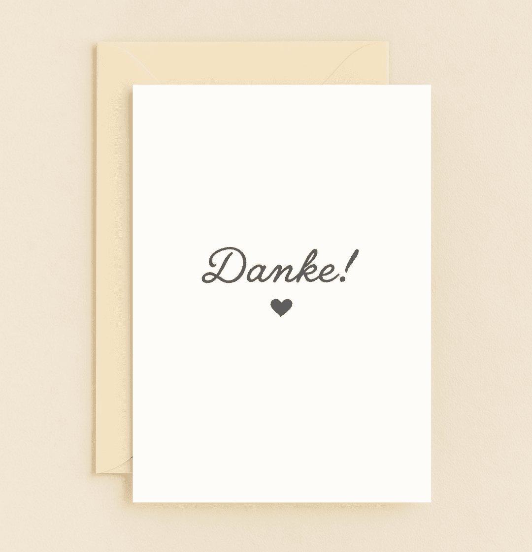 Express your gratitude with a minimalist German "Danke!" card, featuring elegant cursive and a heartfelt black heart on a pristine white background.