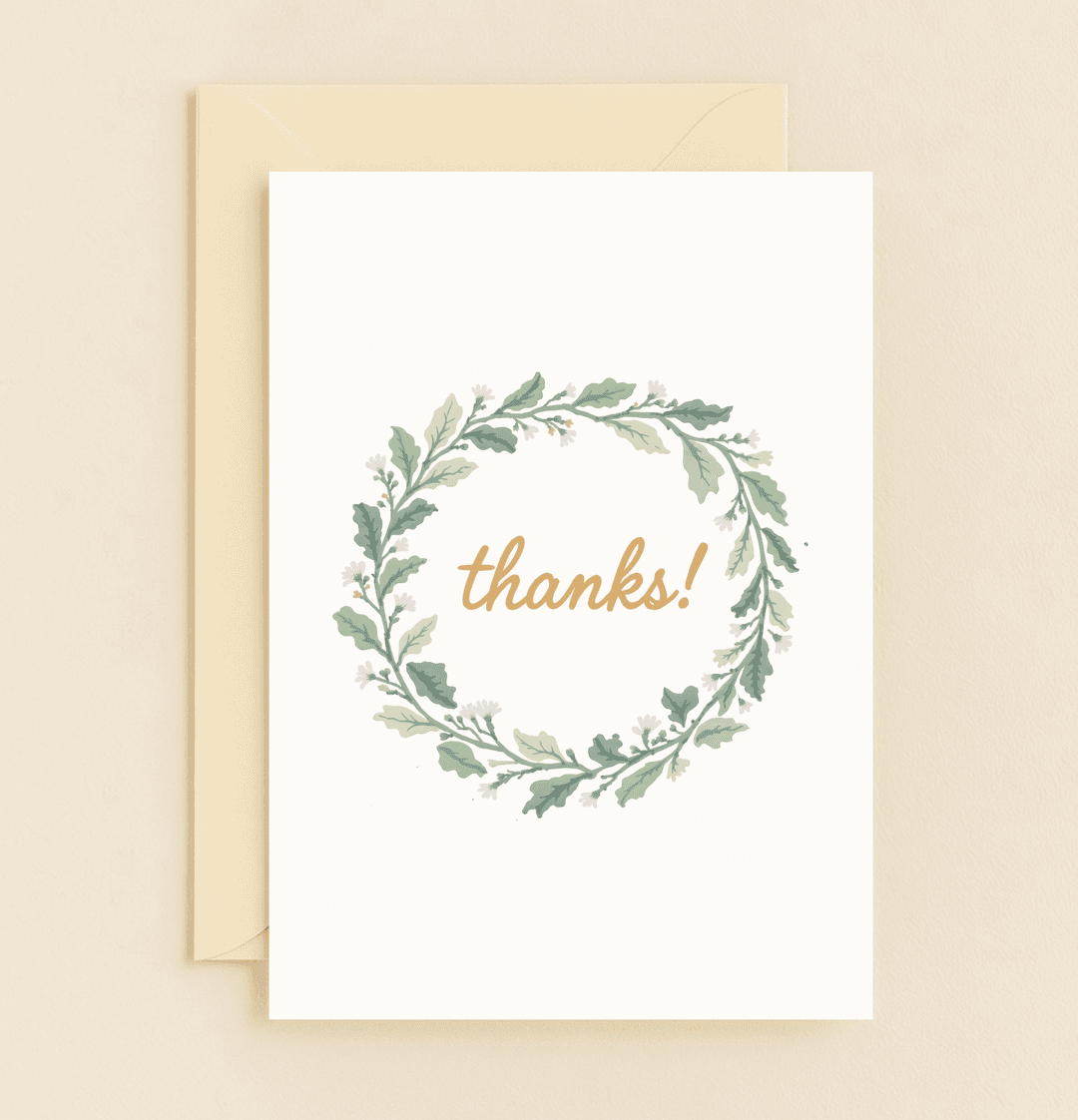Express heartfelt gratitude with "Nature's Grateful Embrace," featuring a delicate wreath of leaves and flowers encircling a warm, cursive "thanks!.