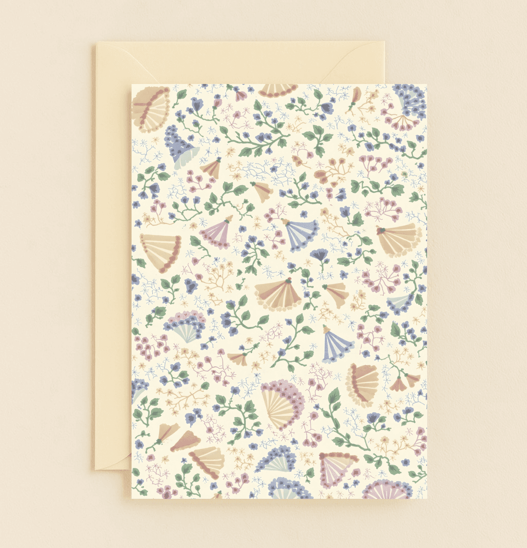 Celebrate Mother's Day with "Whispers of Blooms and Breezes," a pastel-hued card featuring elegant floral patterns and decorative fans on a soft cream backdrop.