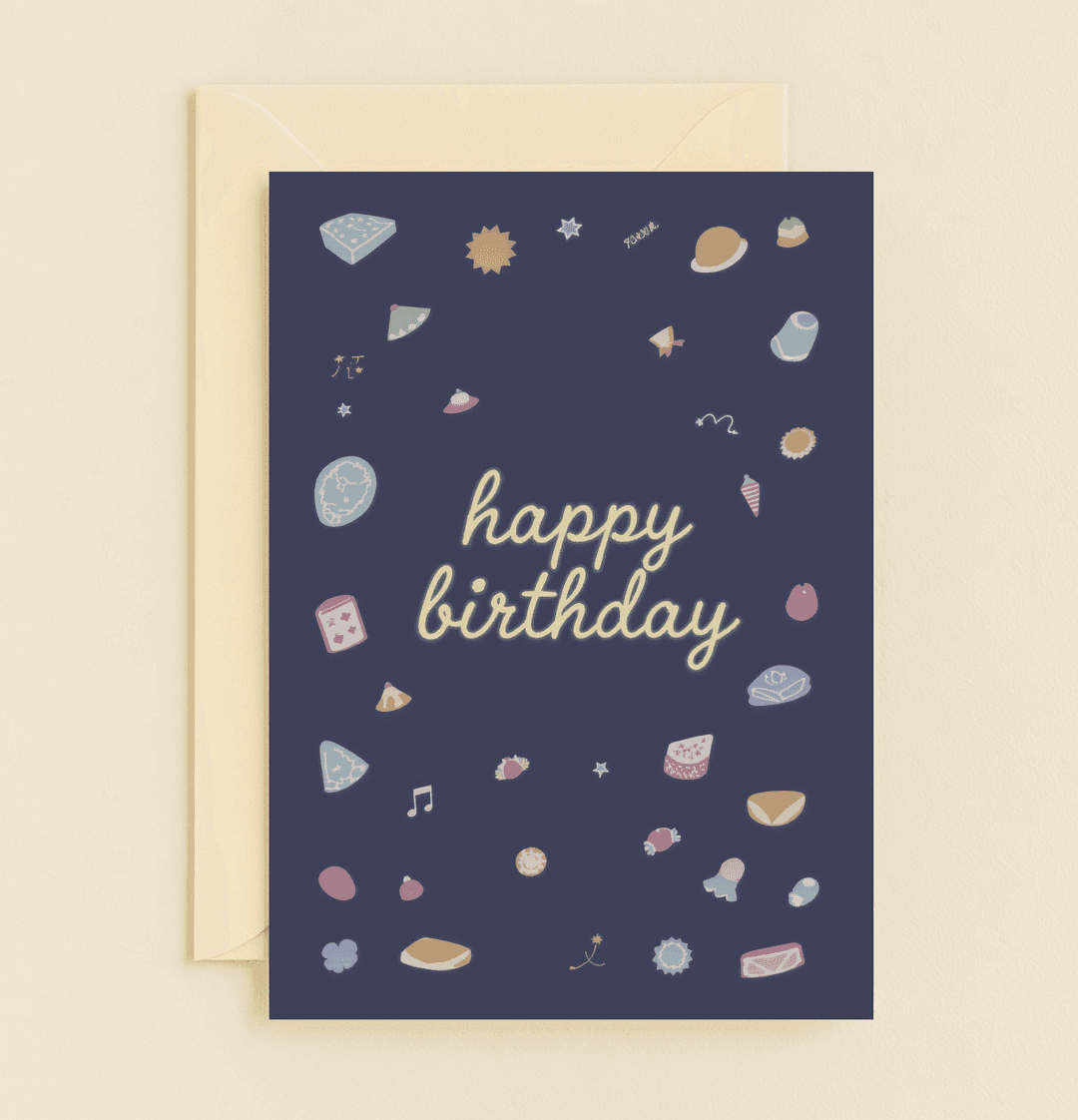Celebrate a whimsical birthday with this playful card featuring pastel icons of cake, candy, and music on a stylish dark blue backdrop.