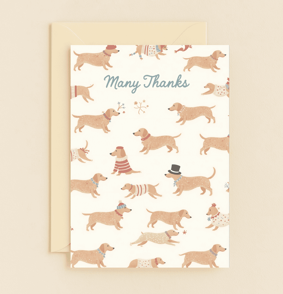 Send your gratitude with our "Dashing Dachshunds Say Thanks!" card, featuring whimsical dachshunds in festive sweaters, hats, and scarves.