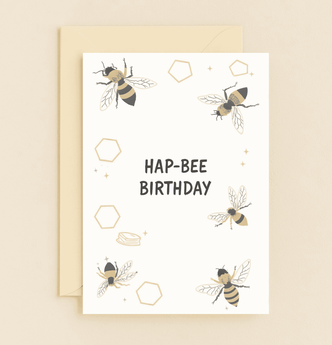 Celebrate a "Hap-Bee Birthday" with a cheerful card featuring playful bees and honeycomb hexagons, perfect for pun lovers.
