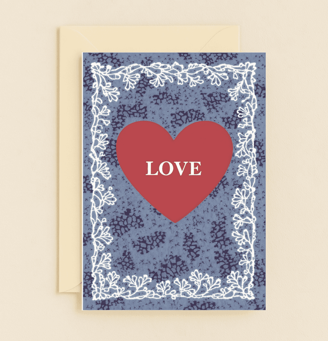 Celebrate your enduring love with this elegant anniversary card, featuring a bold red heart and intricate floral borders against a textured blue backdrop.