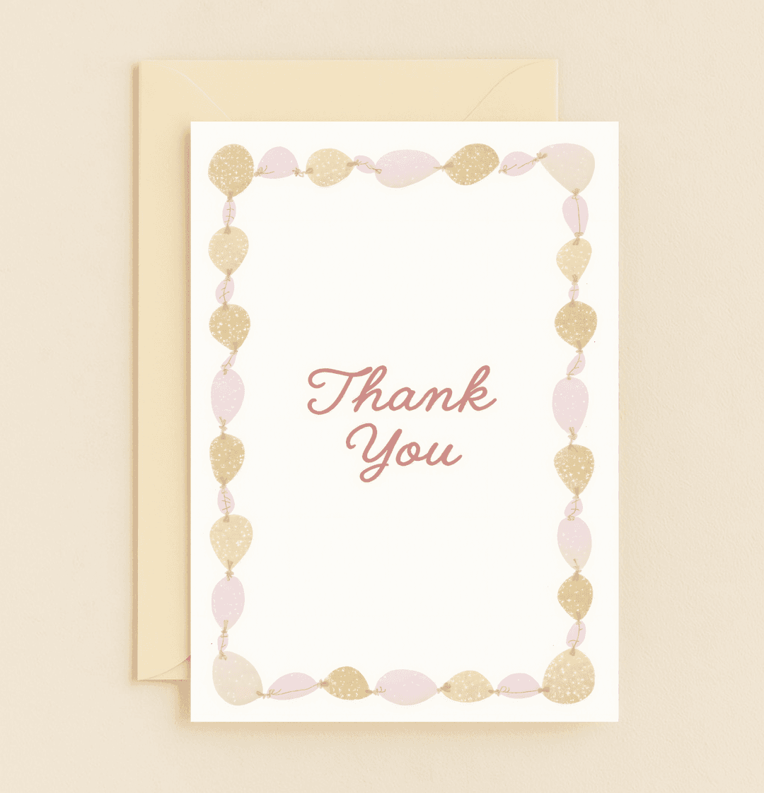 Express heartfelt thanks with this elegant card, featuring sparkling pastel pink and gold balloons and a graceful "Thank You" in cursive.