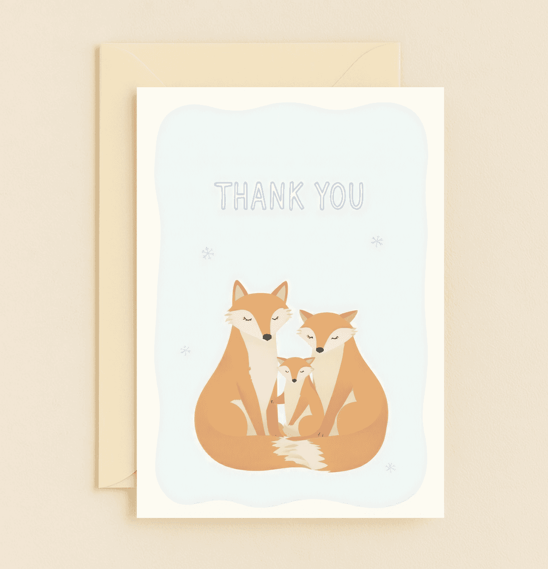 Express heartfelt thanks with this charming card featuring a serene fox family amidst gentle snowflakes, perfect for conveying warmth and gratitude.