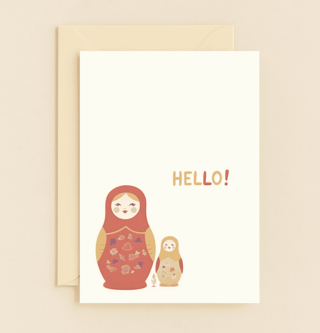 Celebrate Mother's Day with this charming card featuring smiling matryoshka dolls, vibrant floral patterns, and a cheerful "HELLO!" to honor motherhood and family.