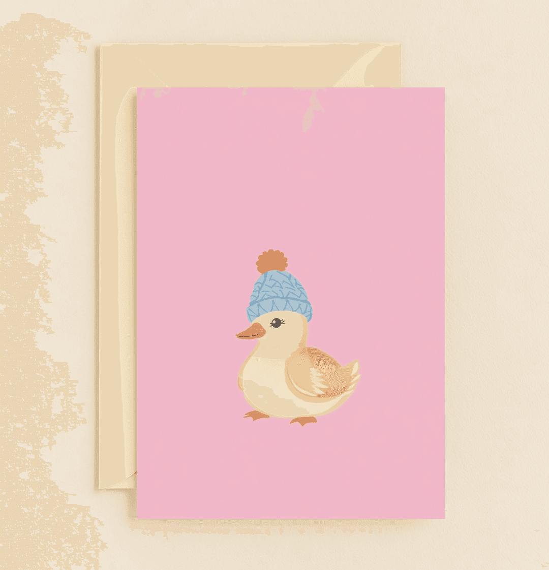 Celebrate Easter with a charming duckling in a cozy blue beanie, complete with an orange pom-pom, set against a delightful pink backdrop.