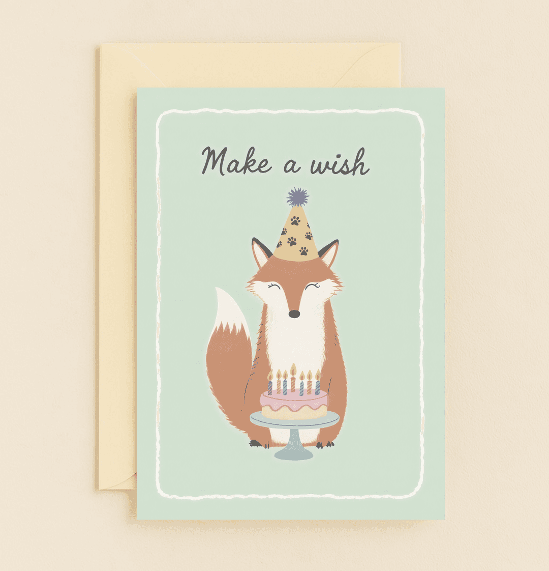 Celebrate a birthday with a whimsical fox in a party hat, ready to make a wish behind a cake adorned with candles on a mint green backdrop.
