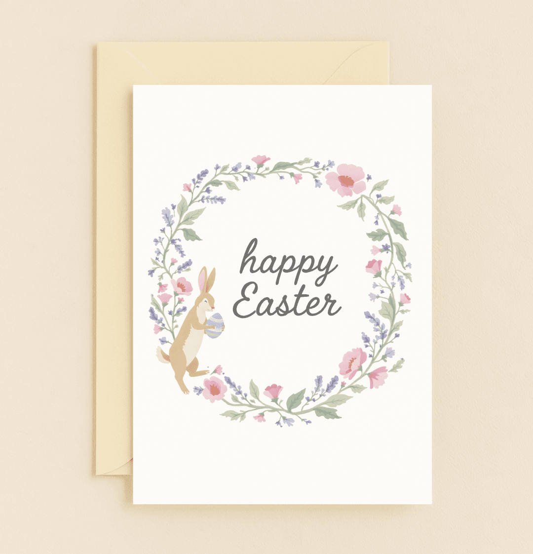 Celebrate Easter with a cheerful card featuring a pastel floral wreath, playful rabbit, and Easter egg, embodying the joyful spirit of springtime.