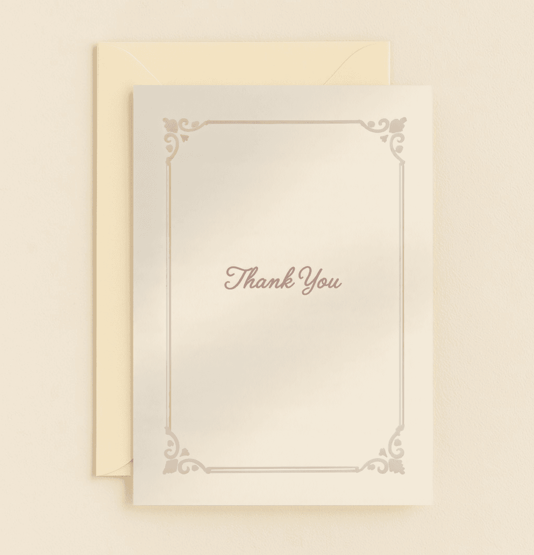 Express timeless gratitude with this elegant thank you card, featuring a vintage floral border and classic cursive script on a soft beige background.