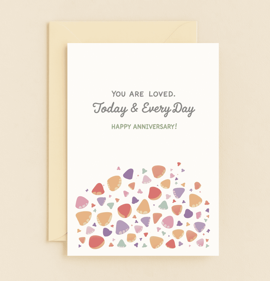 Celebrate your love with this bright and playful anniversary card featuring heartfelt messages and a vibrant pattern of abstract hearts and petals.