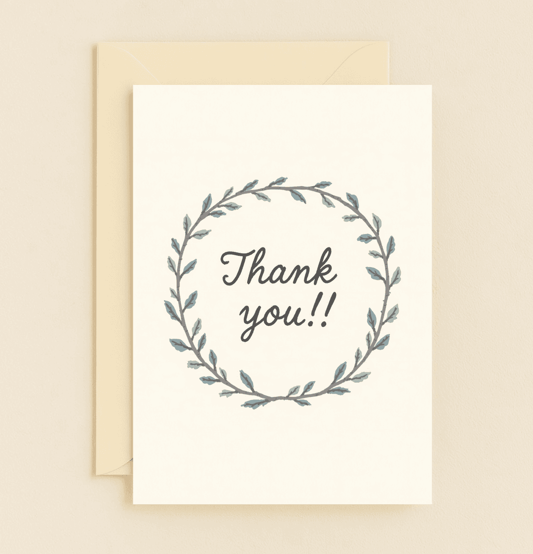 Express heartfelt gratitude with this elegant thank you card featuring a cursive message encircled by a minimalist wreath of green and blue leaves.