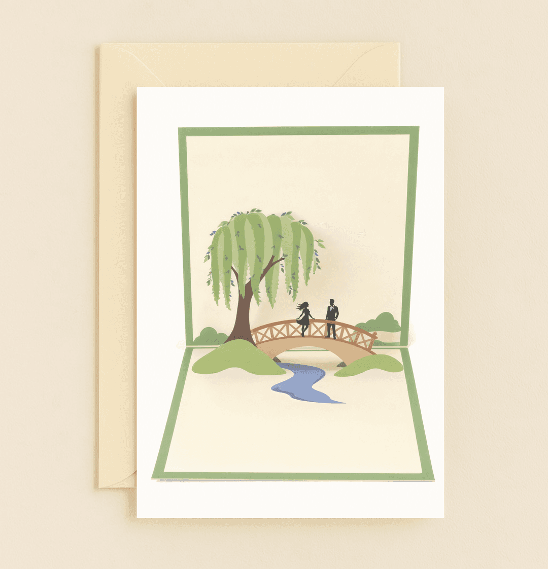 Celebrate your anniversary with a pop-up card featuring a silhouette couple sharing whispers of love beneath a willow in a serene, romantic park setting.