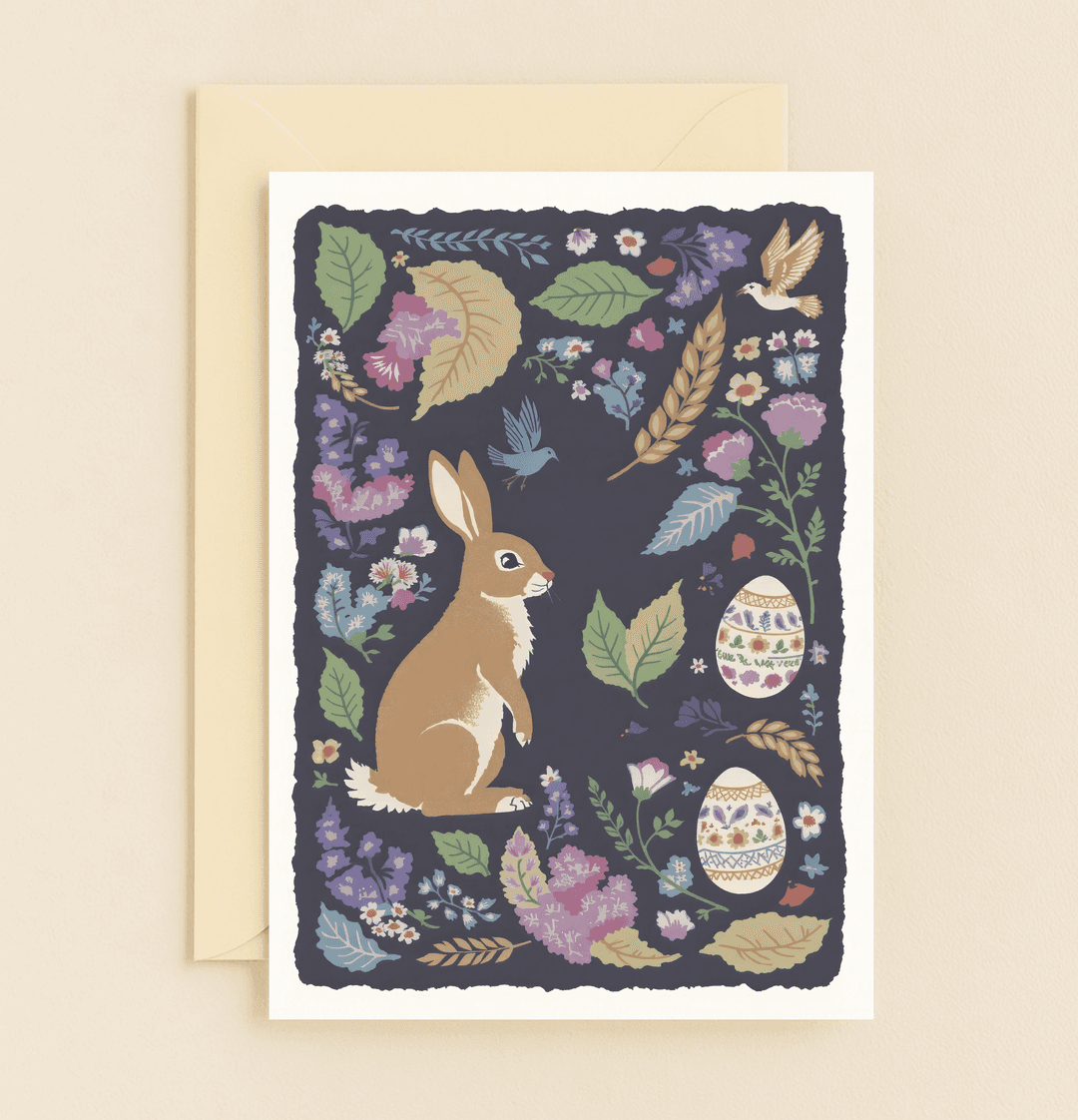 Celebrate Easter with a whimsical card featuring a charming rabbit, vibrant florals, and festive Easter eggs in a delightful springtime scene.