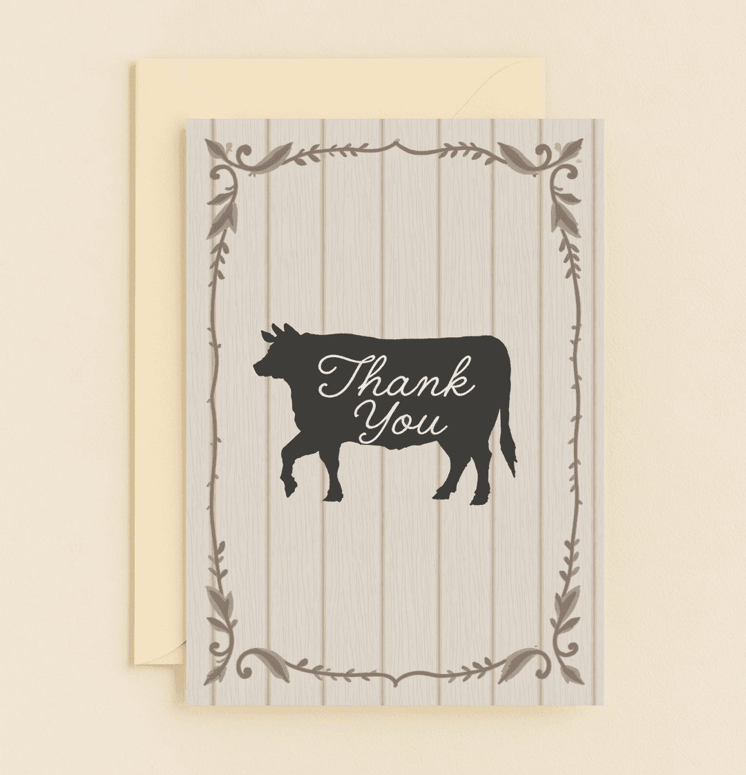 Express your gratitude with rustic charm and a touch of humor using our "Udderly Grateful" card featuring a cow silhouette and elegant script on a wooden backdrop.