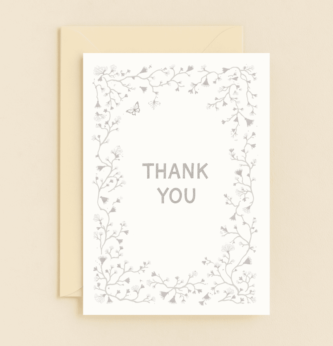 Express your gratitude with the "Whimsical Vines of Gratitude" card, featuring delicate floral vines and a charming butterfly on a crisp white backdrop.