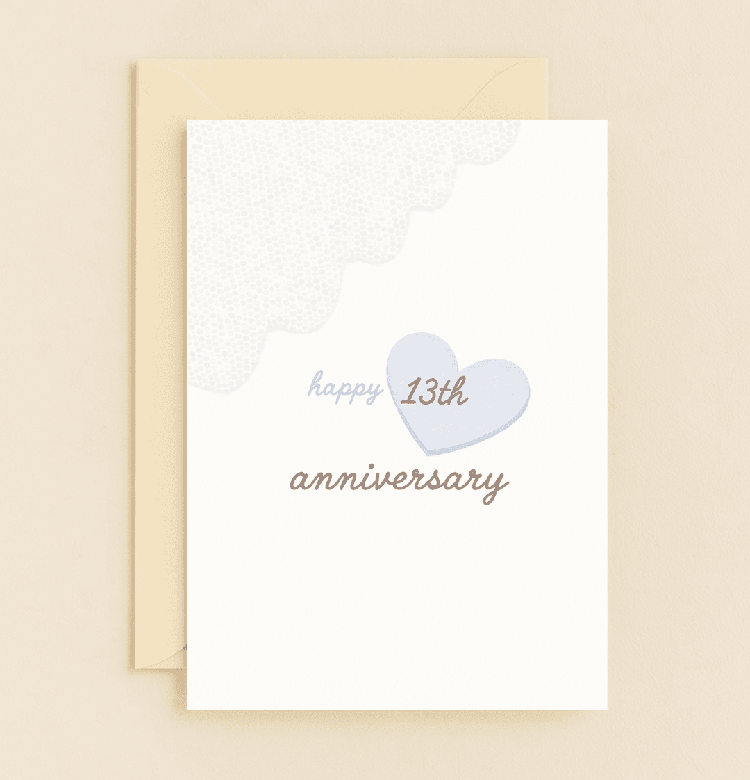 Celebrate thirteen years of love with this minimalist anniversary card featuring a light blue heart, elegant text, and a charming scalloped edge.