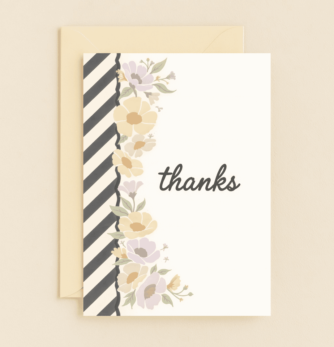 Express your gratitude with this elegant card featuring pastel floral accents, black and white stripes, and a cursive "thanks" for a minimalist, stylish touch.