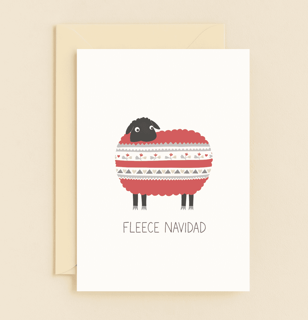 Send warm holiday cheer with "Wooly Wishes for Cozy Holidays," featuring a playful sheep in a Christmas sweater and the punny greeting "FLEECE NAVIDAD.