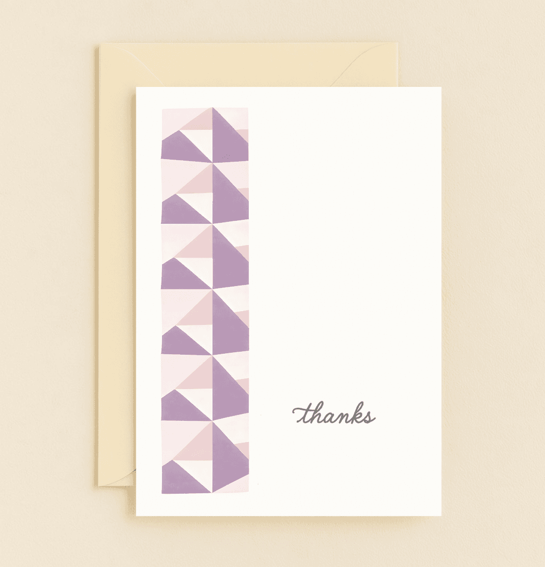 Express your appreciation with our Geometric Gratitude Thank You Card, featuring a chic vertical strip of purple, pink, and white triangles and a cursive "thanks.