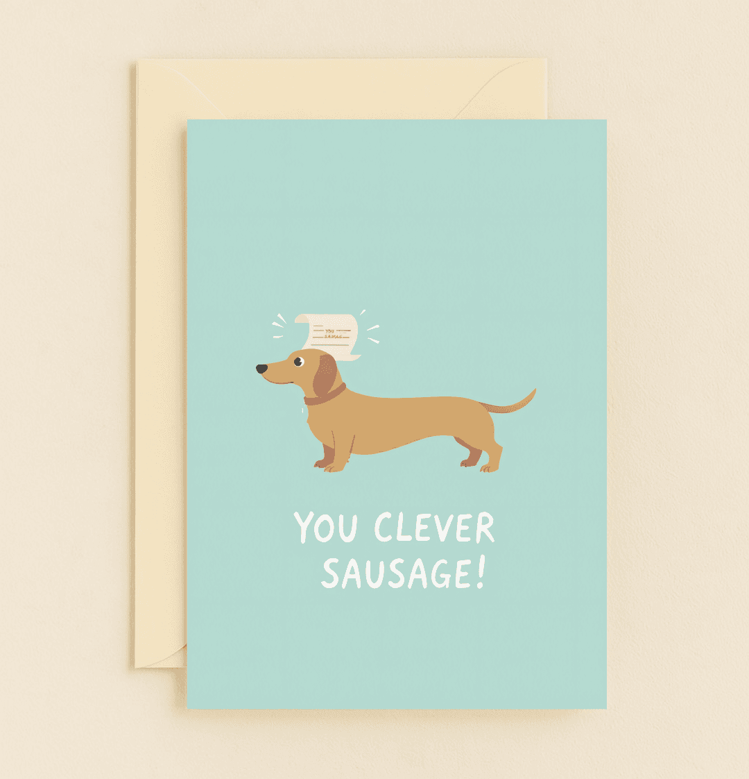 Celebrate graduation with a whimsical dachshund card featuring clever wordplay and a congratulatory scroll, perfect for your "clever sausage!.