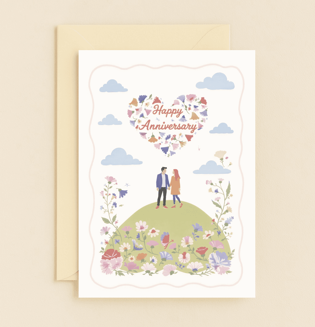Celebrate your love with this romantic anniversary card featuring a couple on a flower-filled hill beneath a heart-shaped floral sky.