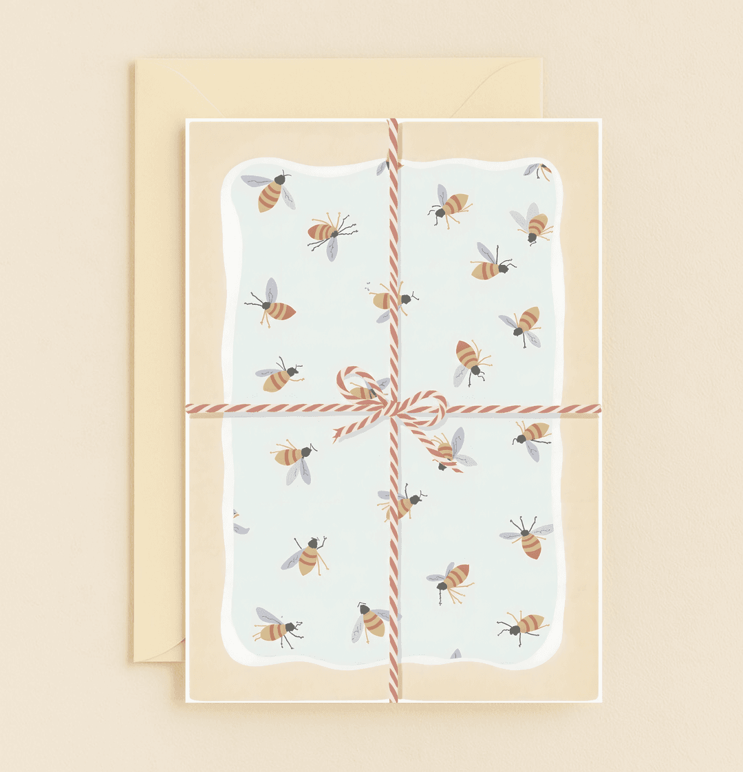 Brighten Mom's day with our "Bee Happy Tidings for Mom!" card, featuring playful bee patterns and a charming ribbon bow for a whimsical Mother's Day surprise.