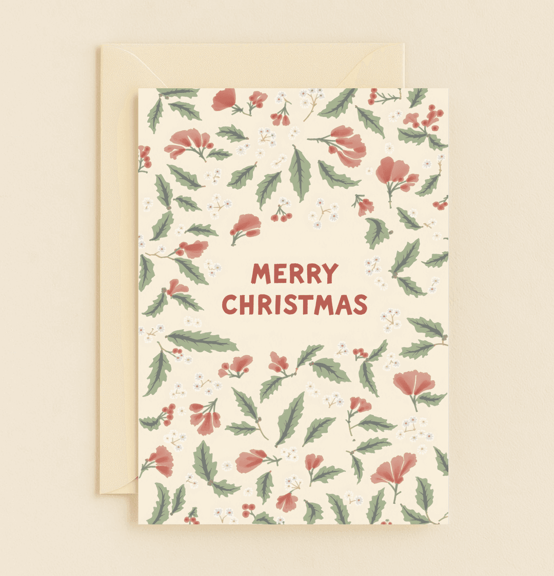 Celebrate the season with "Festive Blooms and Yuletide Joy," a Christmas card adorned with holly, berries, and flowers on a cream background.