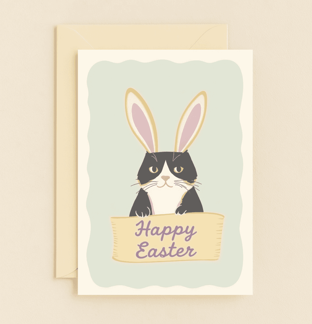 Send "Purrfectly Hoppy Easter Wishes" with this charming card featuring a cat in bunny ears, holding an Easter sign, perfect for cat lovers and pun enthusiasts.
