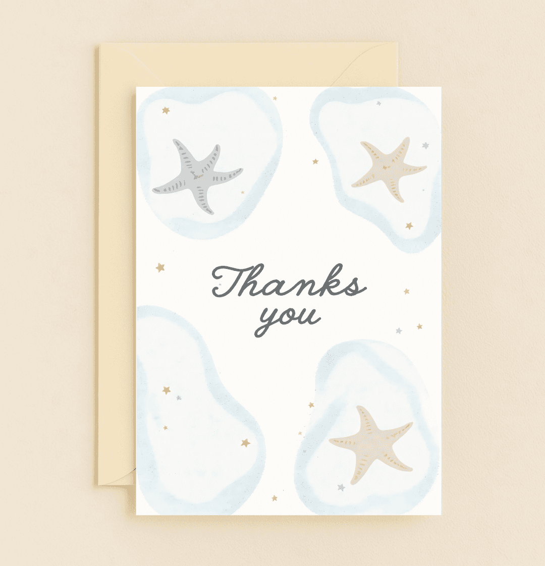 Express your gratitude with this elegant coastal-themed card, featuring watercolor ocean splashes, starfish illustrations, and whimsical golden stars.