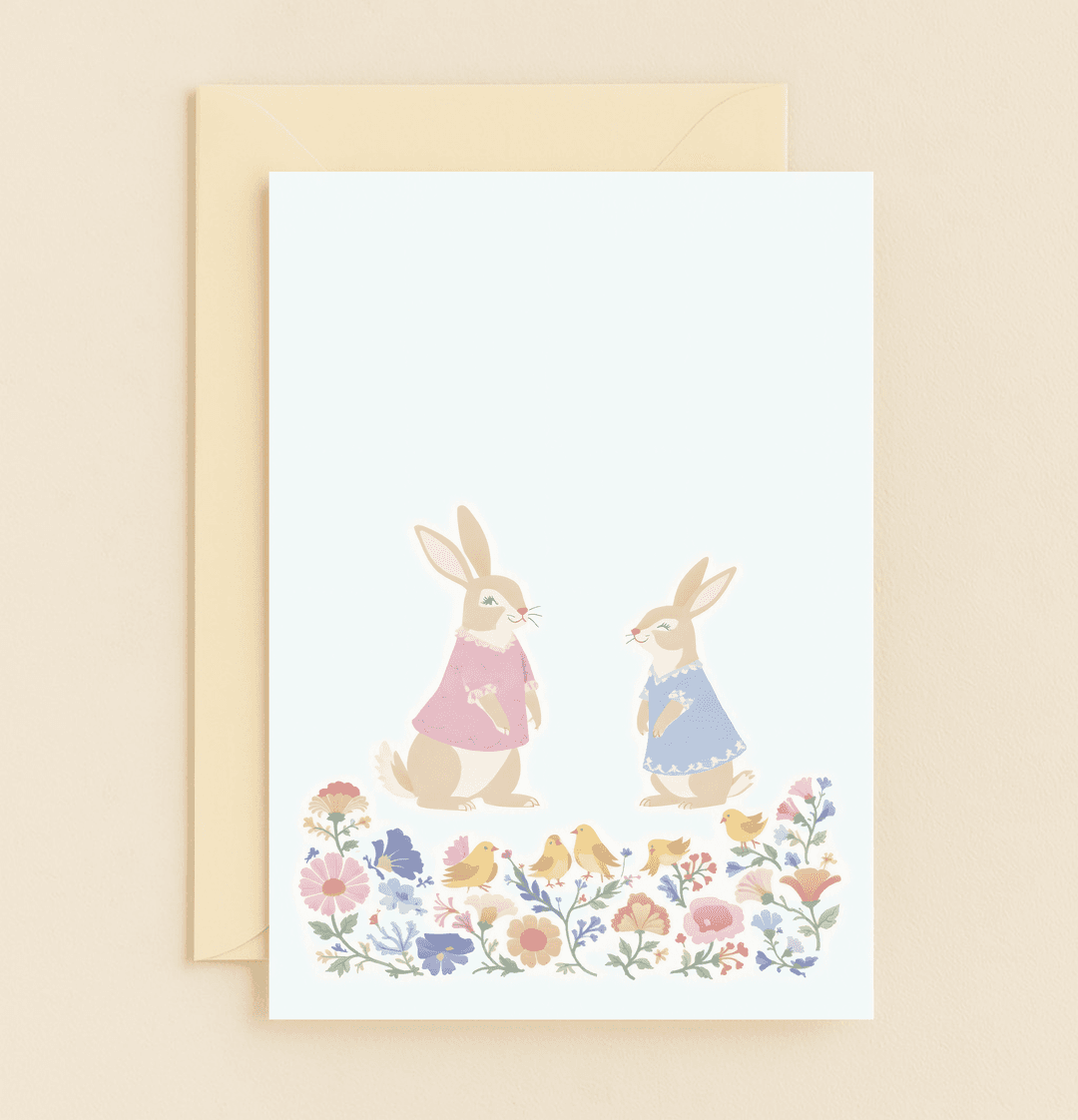 Celebrate Easter with a charming pastel card featuring cute rabbits and chicks surrounded by vibrant spring flowers, perfect for family and friends.