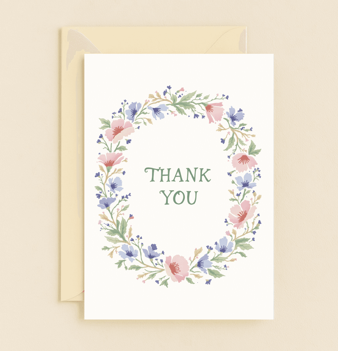 Express heartfelt gratitude with this elegant thank you card featuring a watercolor floral wreath in soothing pastel hues and a refined serif font.