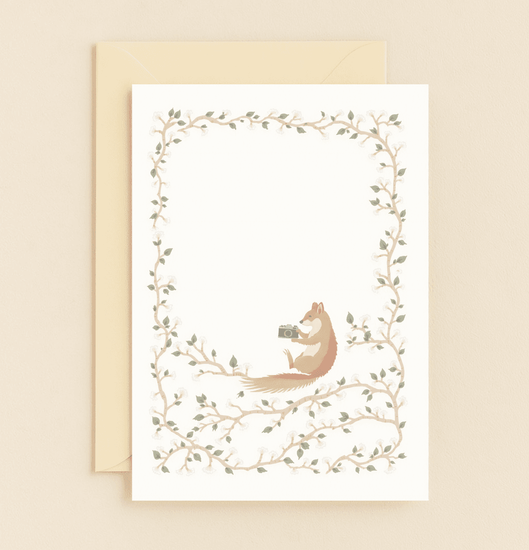 Express your gratitude with this whimsical card featuring a chipmunk photographer amidst a floral vine, perfect for capturing heartfelt thanks.