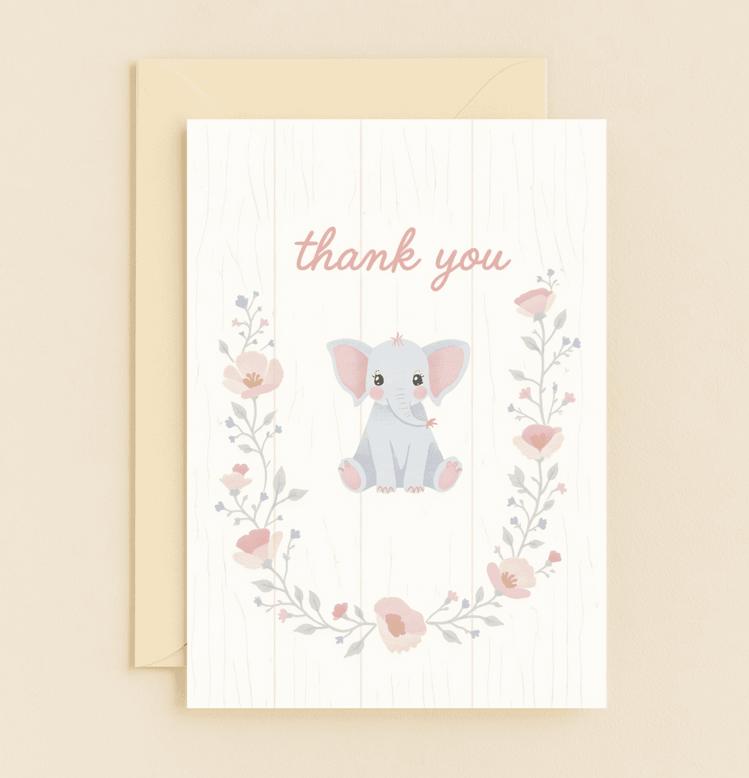Express your gratitude with the "Adorable Elephant Gratitude Blooms" card, featuring a charming cartoon elephant amidst pastel florals on a rustic wood background.