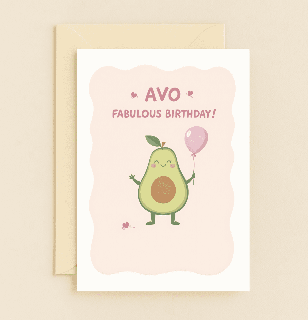 Celebrate a friend's birthday with a pastel pink card featuring a charming cartoon avocado, heart accents, and playful wordplay for an "avo-fabulous" day!.