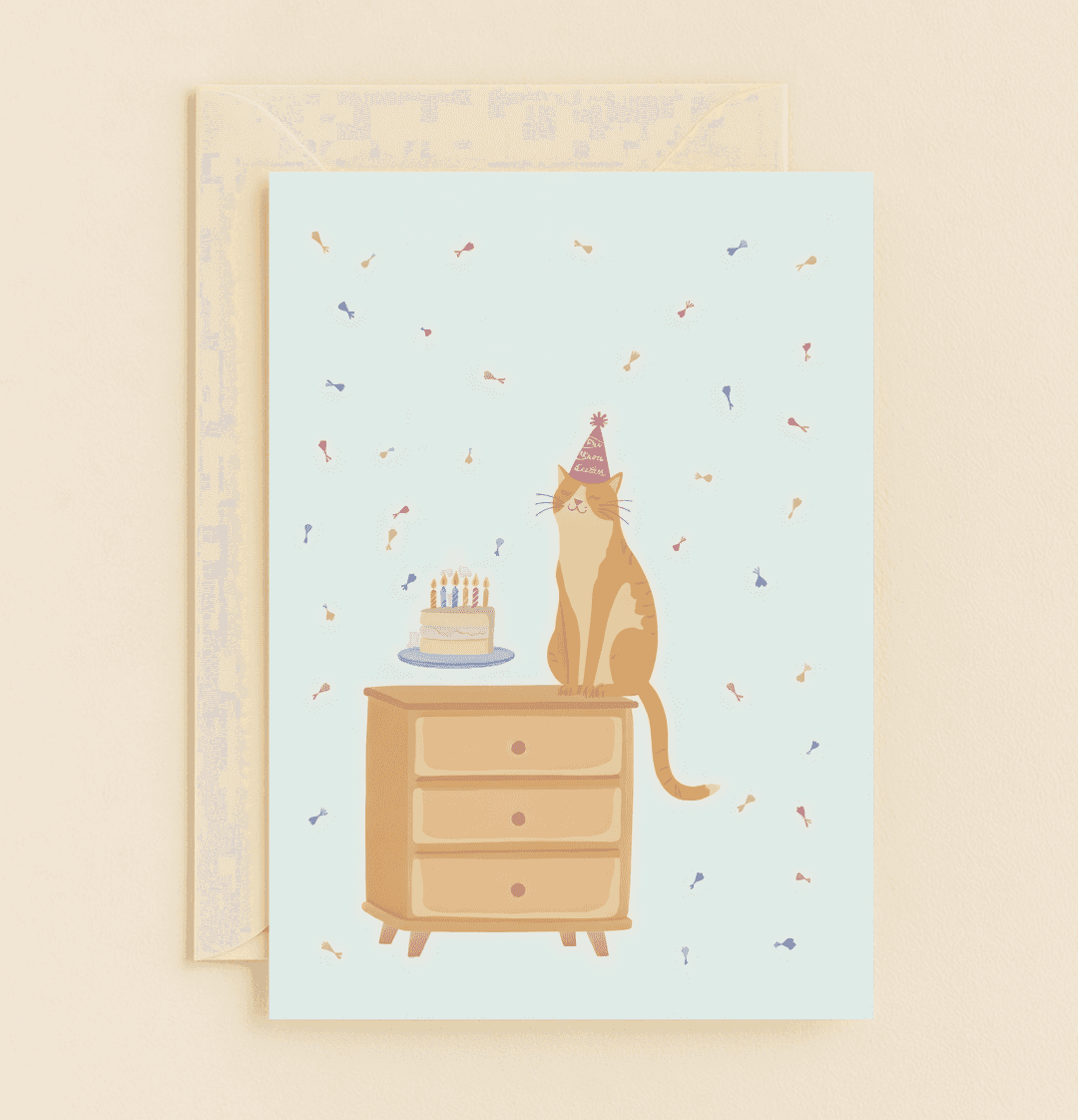Celebrate a purr-fect birthday with this whimsical card featuring a party-loving cat atop a dresser, complete with cake, candles, and charming wordplay.