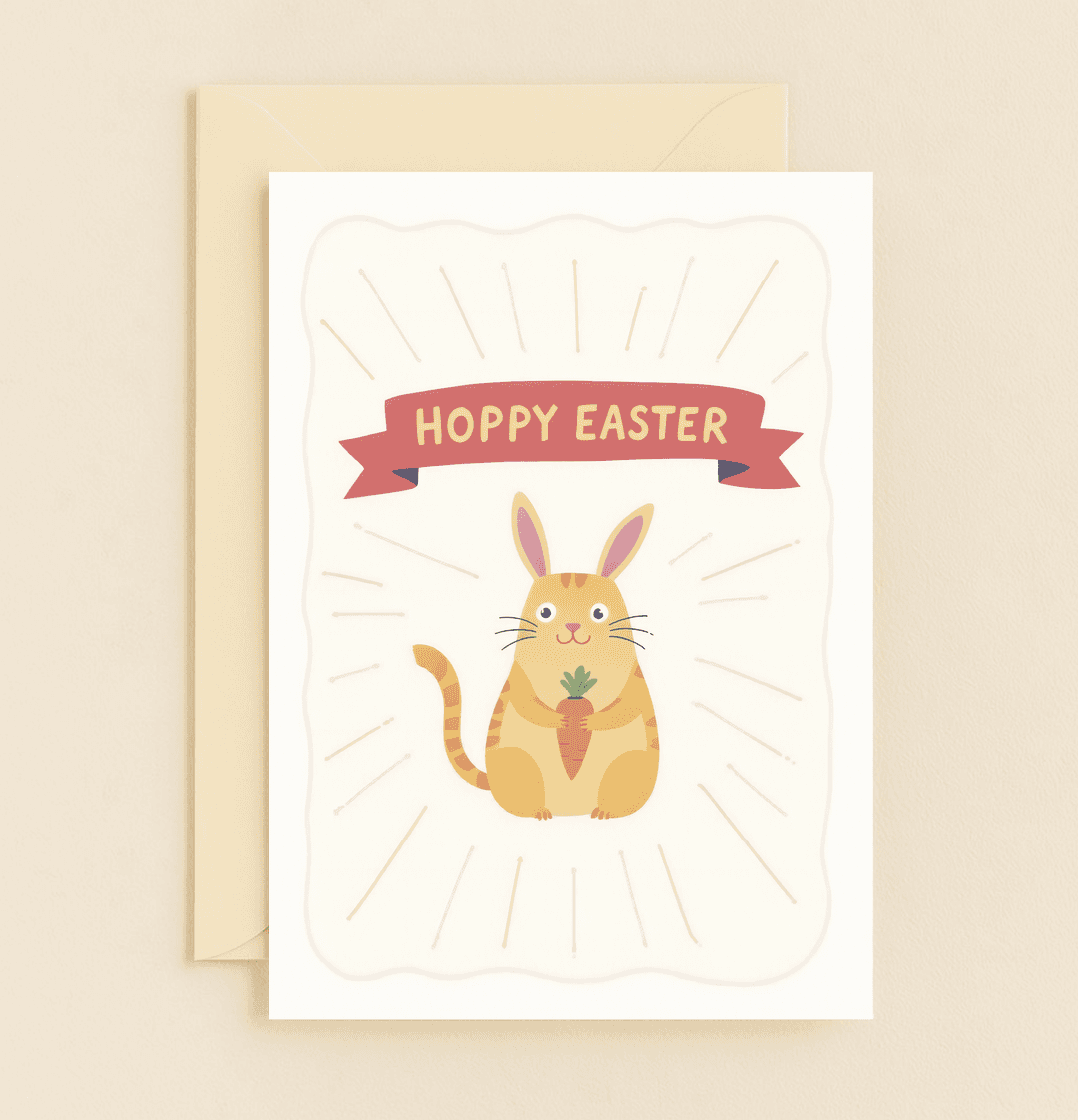 Celebrate Easter with a purrfectly playful card featuring a bunny-eared cat and carrot pun, sure to bring a smile with its vibrant, festive design.