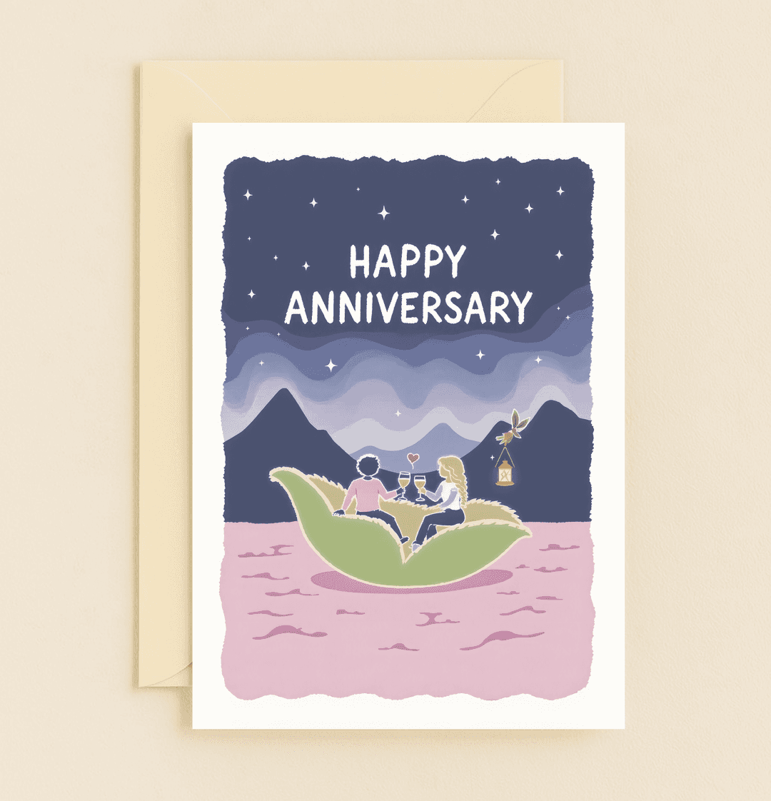 Celebrate your anniversary with a whimsical card depicting a romantic dinner on a green leaf floating under a starry, moonlit sky and pink ocean.
