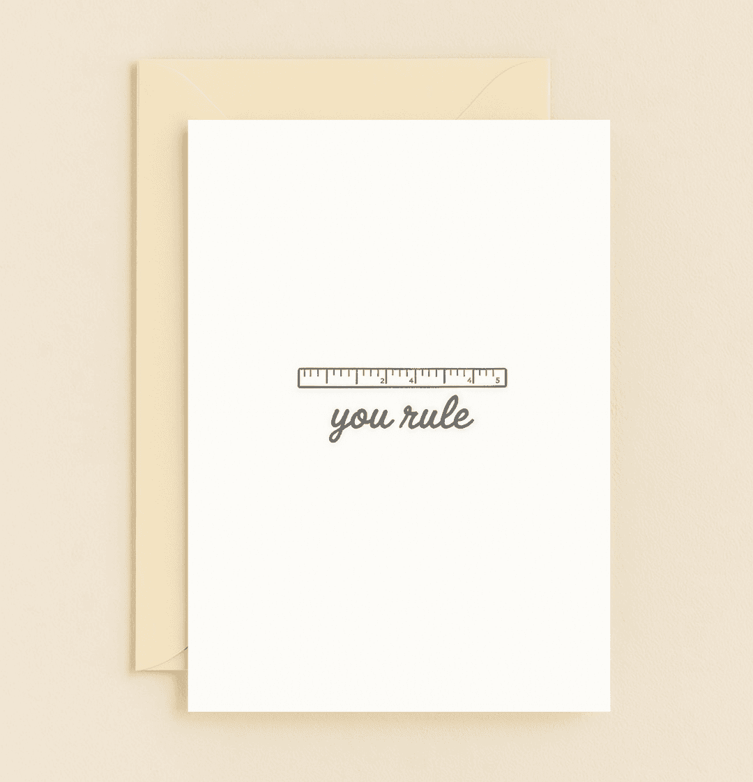 Express your gratitude with a playful pun and minimalist design featuring a ruler illustration and cursive "you rule" message for a touch of appreciation.