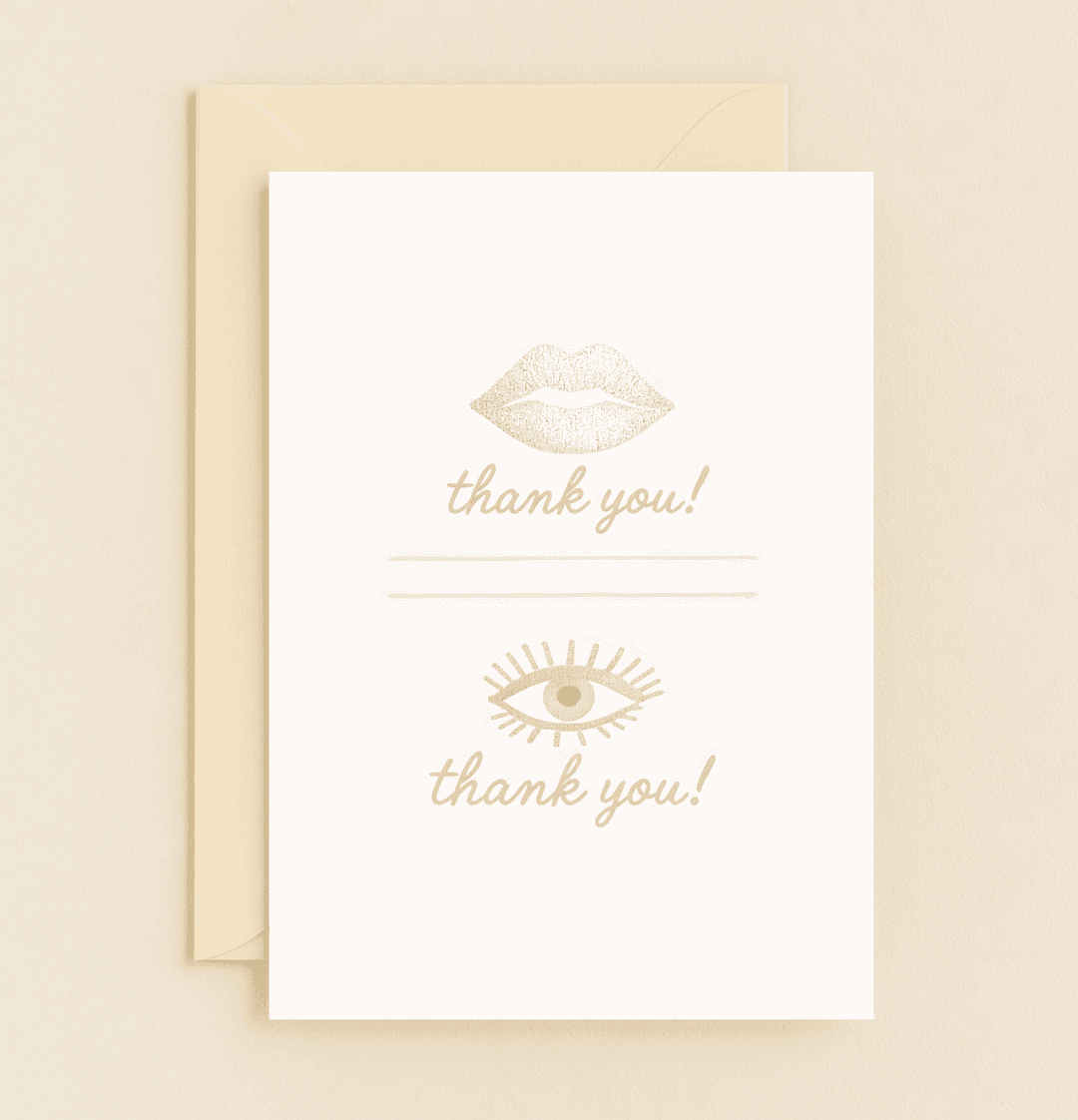 Express heartfelt thanks with this elegant, minimalist card featuring silver lips, a golden eye, and stylish lavender accents.